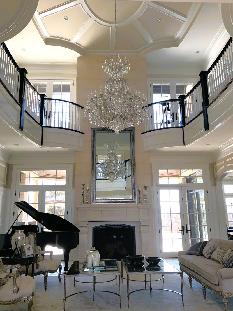 Living room with firepit and view of first floor windows