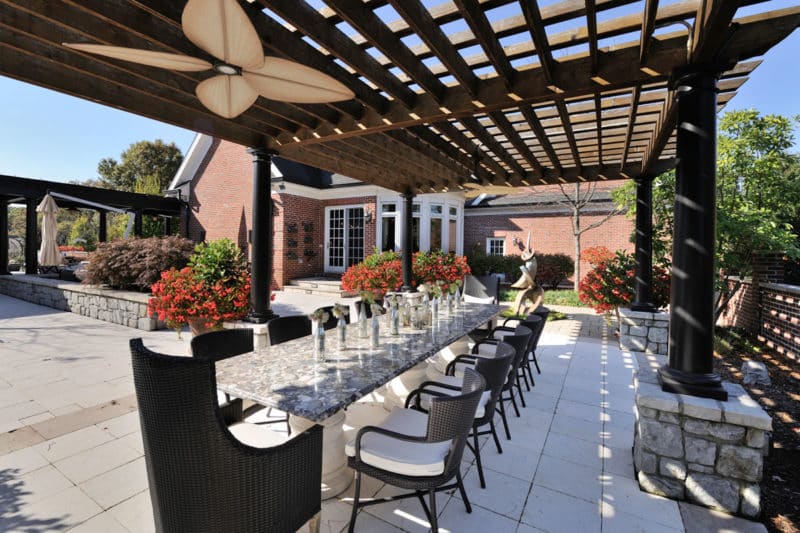 Renovated patio with dining table at pool house