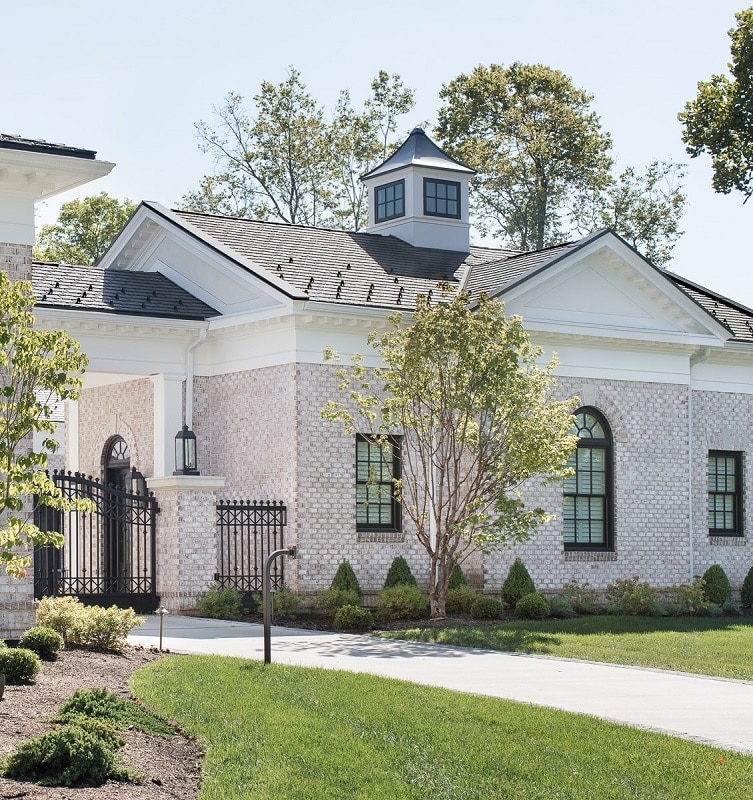 St. Louis residential architecture custom homes rear entry garage cupola port cochere